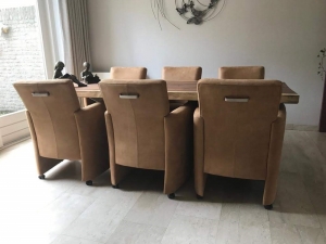 Setvan6lereneetkamerfauteuils-metarmleuningenwieltjes-bruinleer-EchtleerModernontdekdeveleLeersoortenenKleurenbijShopX