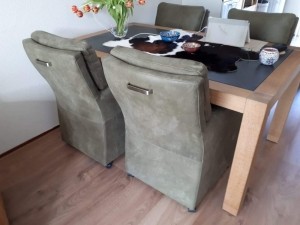 Setvan4lereneetkamerfauteuils-metarmleuningenwieltjes-groenleer-EchtleerLandelijkontdekdeveleLeersoortenenKleurenbijShopX